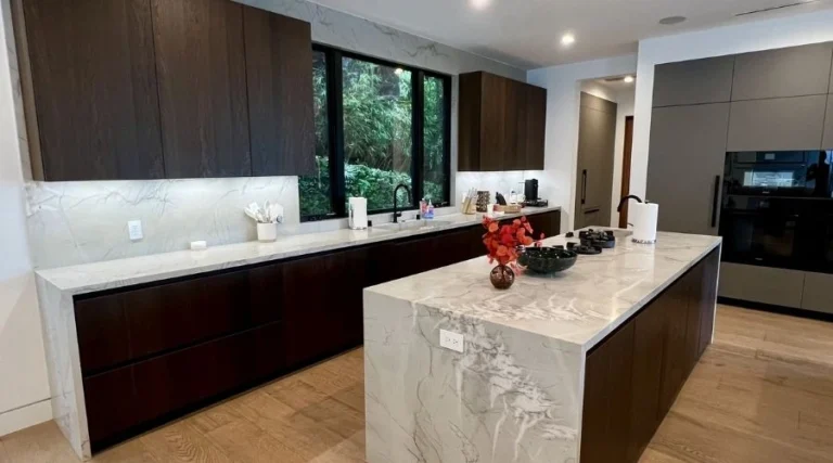 Open-concept kitchen with island and new fixtures remodeled in Temecula by California Home Center