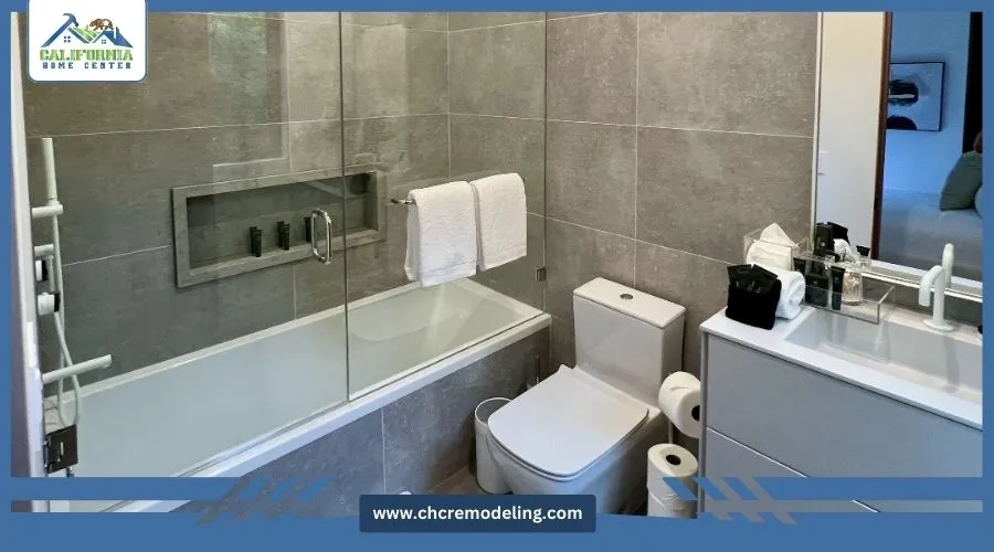 A family bathroom with a bathtub/shower combo, vanity, and toilet.