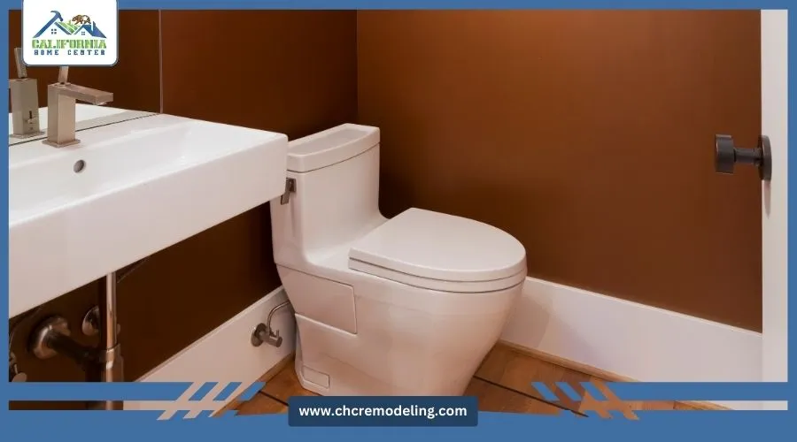Small powder room with toilet and pedestal sink
