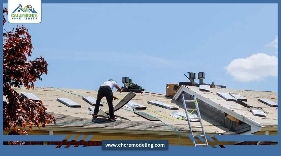 Insurance adjuster inspecting roof damage with contractor present